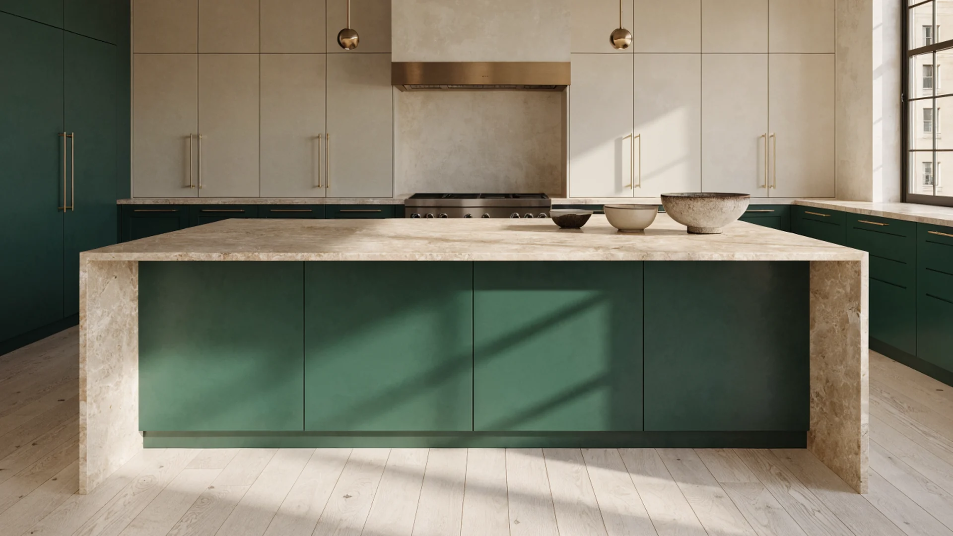 Open kitchen with a marble waterfall island, deep green cabinetry and brass hardware - UHS Remodeling design study